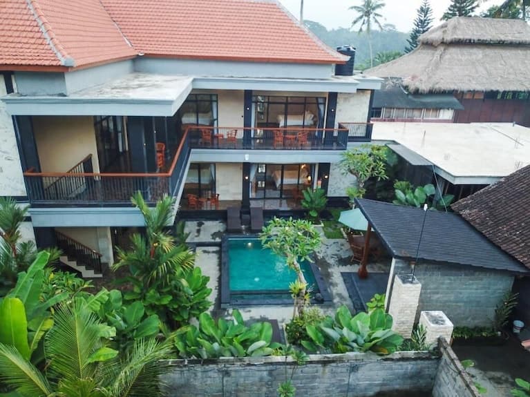 Aerial view of the guesthouse, the pool and the garden