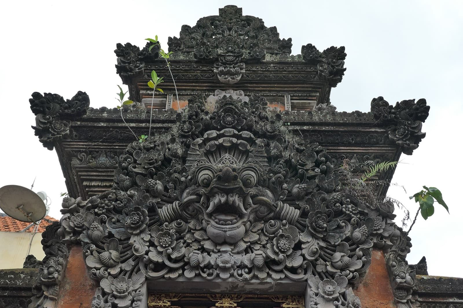 Carved Kala face over one of the gateways