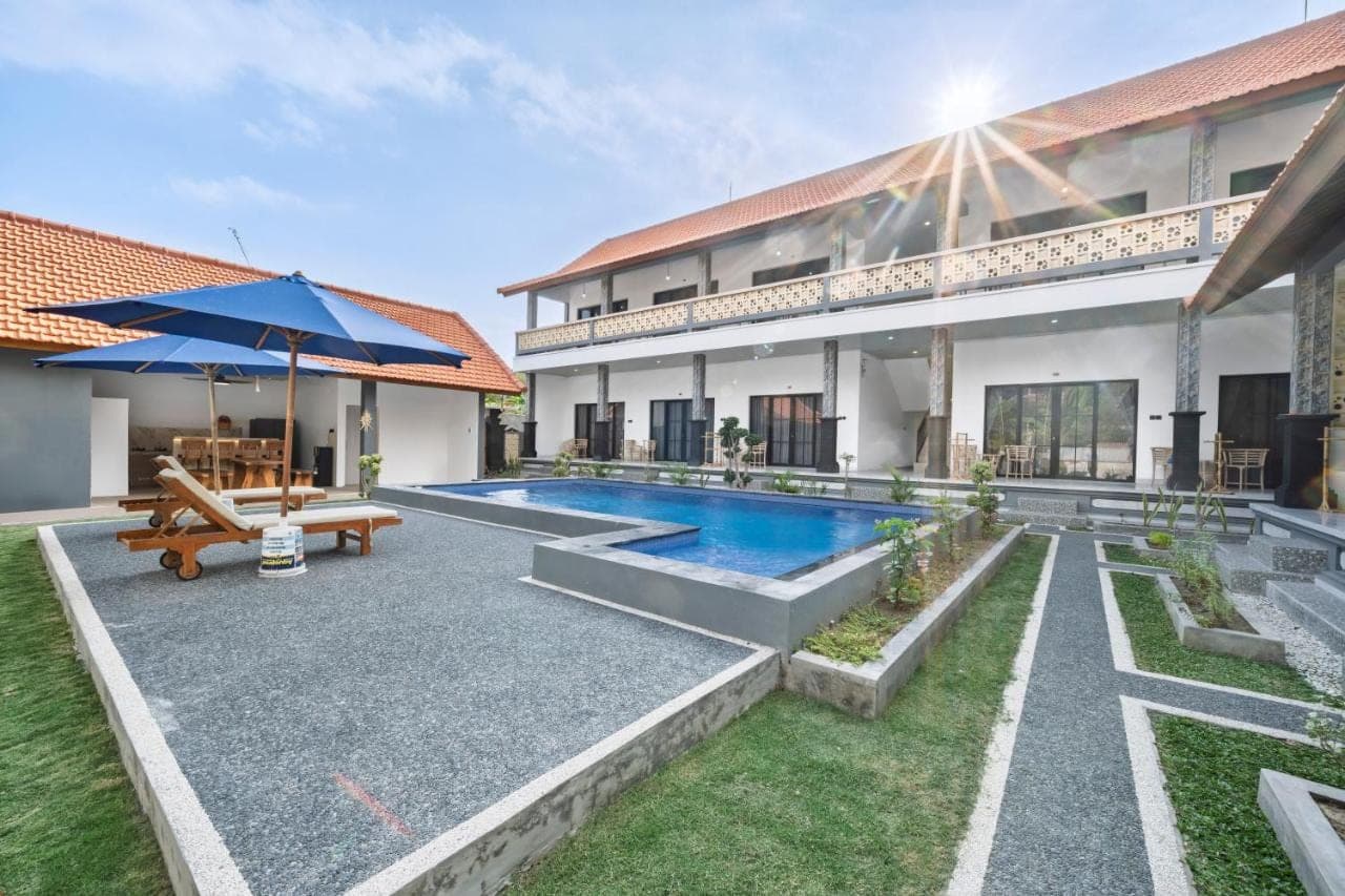 an image of a villa with a swimming pool at Jukung Bali Stay &amp; Surf in Canggu