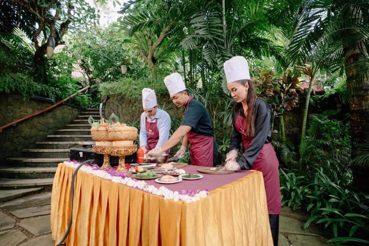 a group of chefs standing around a table with food at Arkamara Dijiwa Ubud in Ubud