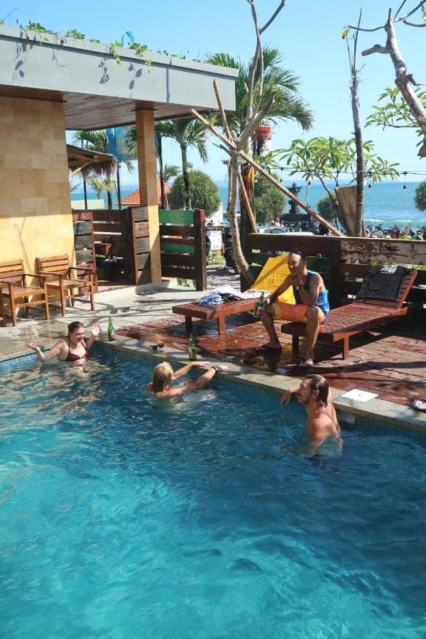 a group of people in a swimming pool at Bima Sakti Homestay Echo Beach Canggu in Canggu