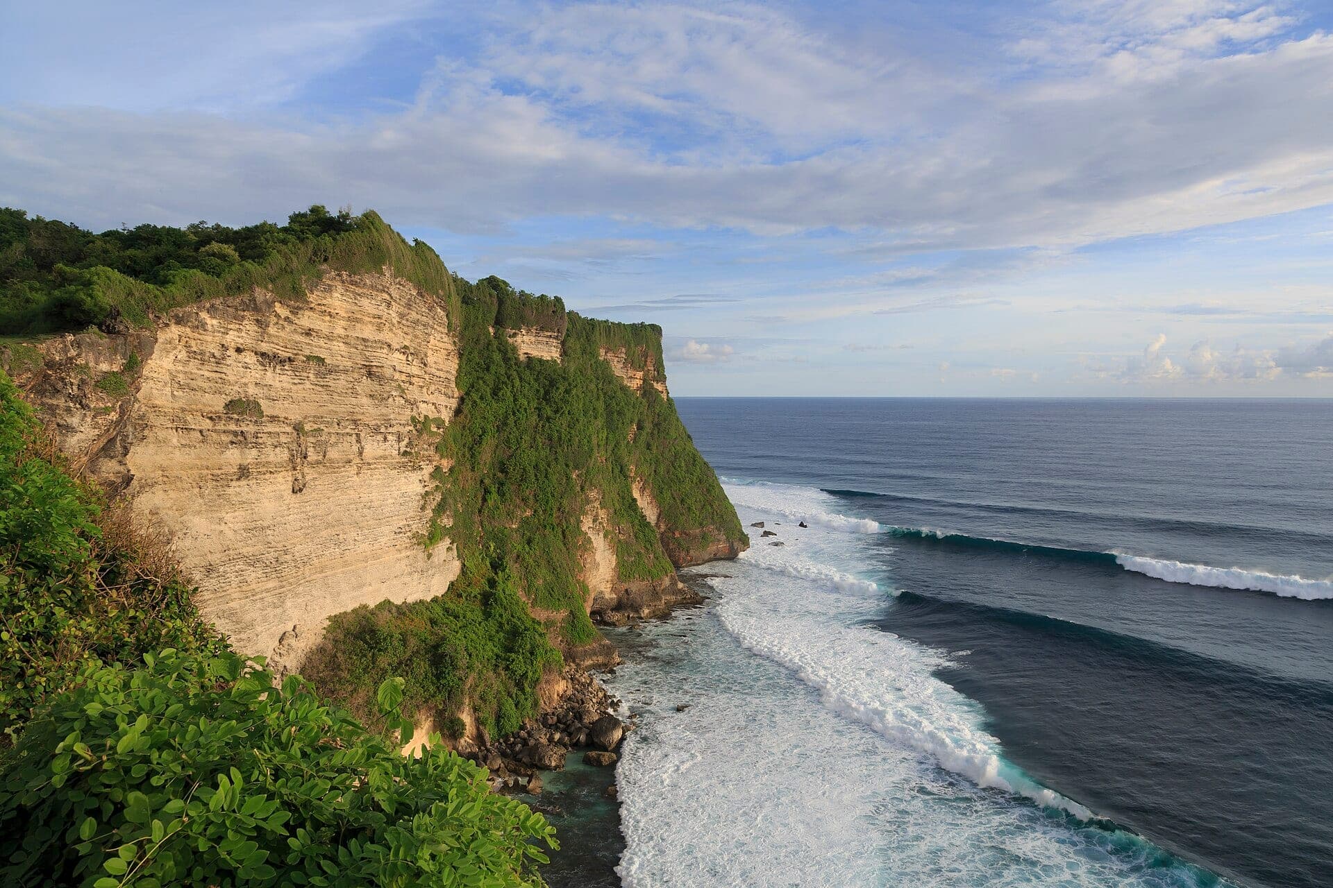 Cliffs at Pura Luhur Uluwatu with temple, wide landscape