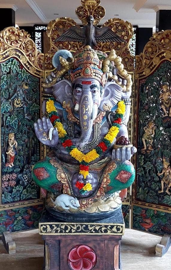 a large statue of a god on a stand at Goa Ganesha in Nusa Dua