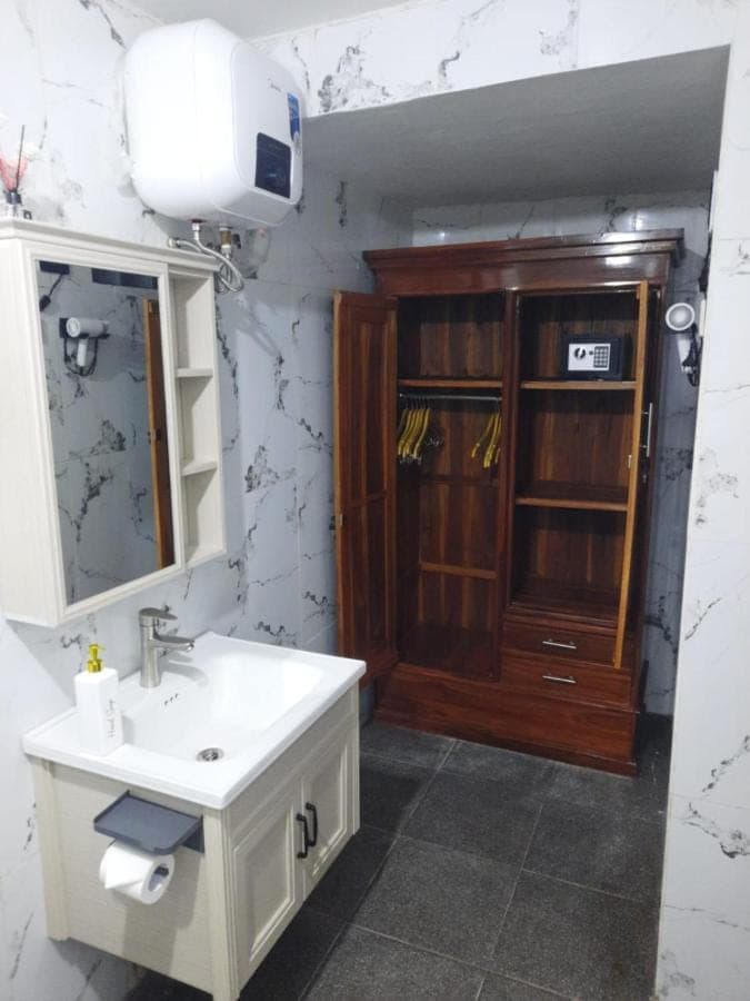a bathroom with a sink and a medicine cabinet at Pondok Klumpu in Nusa Dua