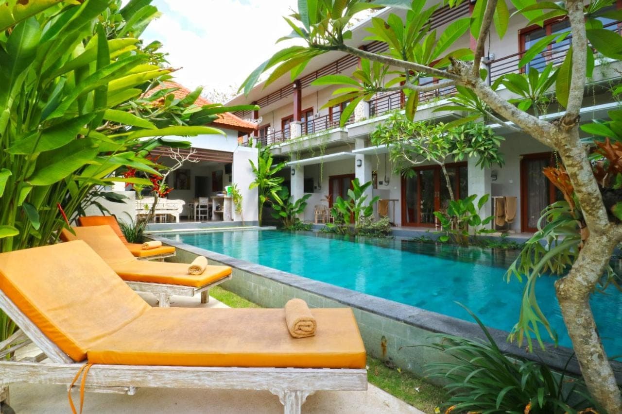 a villa with a swimming pool and a resort at Avisara Nusa Dua in Nusa Dua