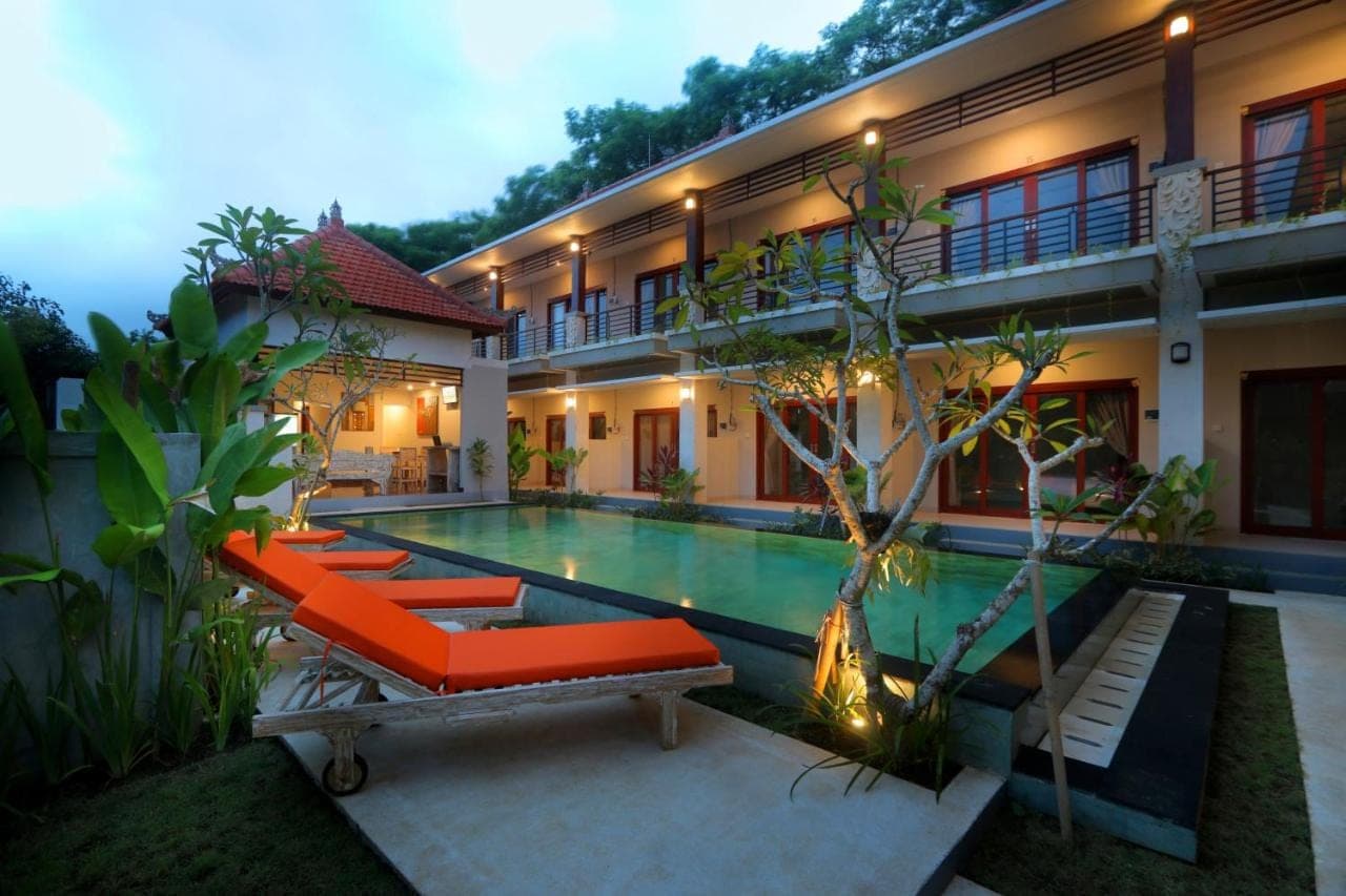 a villa with a swimming pool and a resort at Avisara Nusa Dua in Nusa Dua