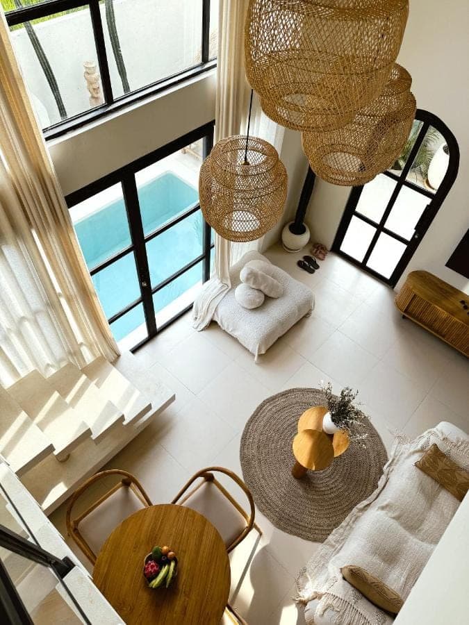 an aerial view of a living room with large windows at Villa Indah Rose Canggu Bali in Canggu