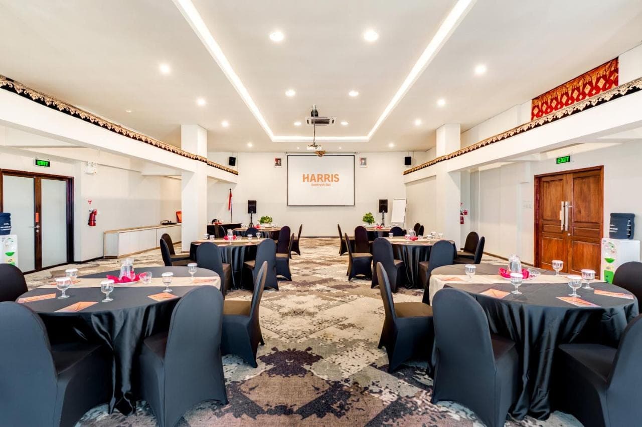 a banquet hall with tables and chairs in a room at HARRIS Hotel Seminyak in Seminyak