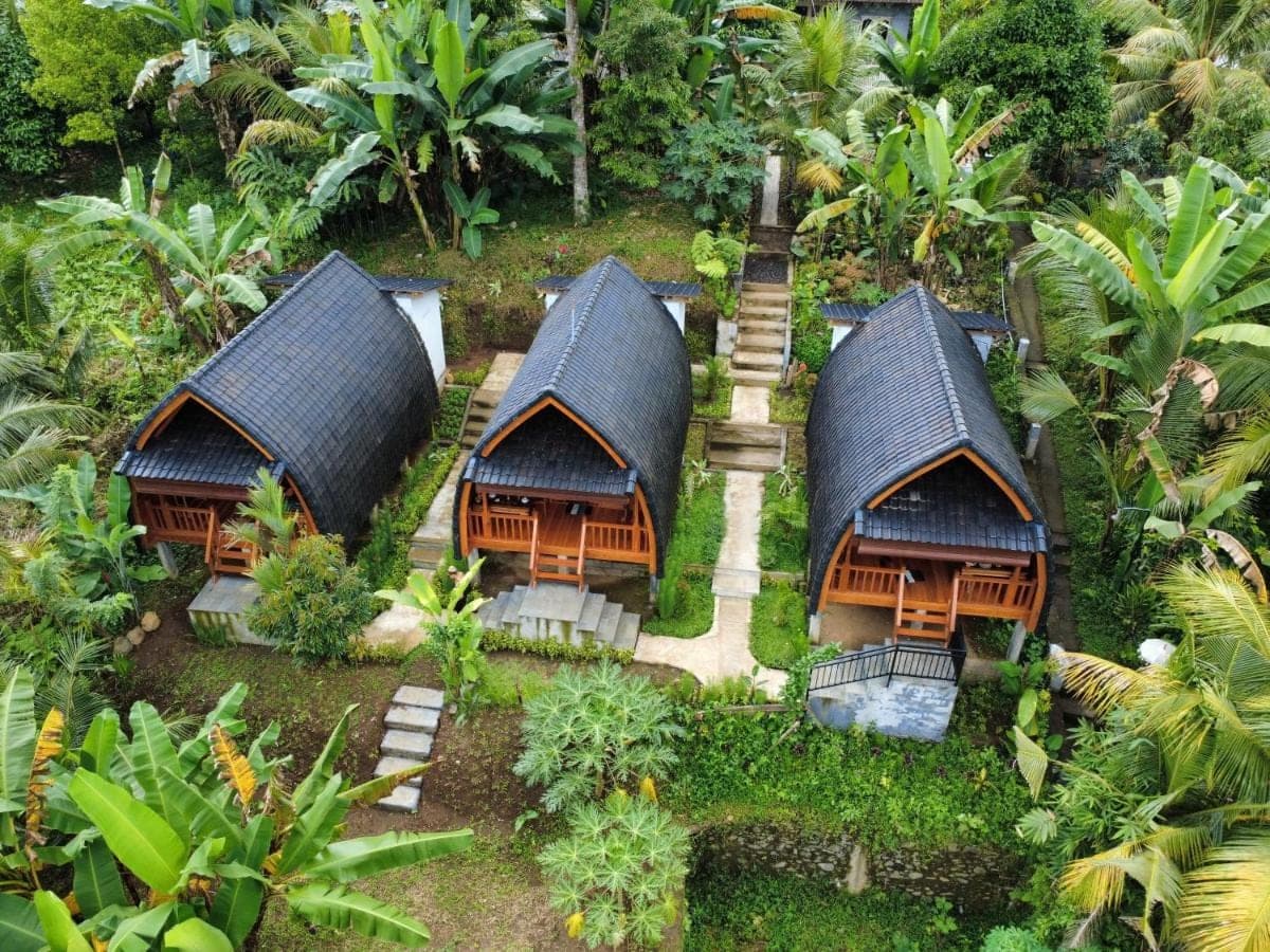 an aerial view of a group of huts at Lumbung Intan in Sidemen