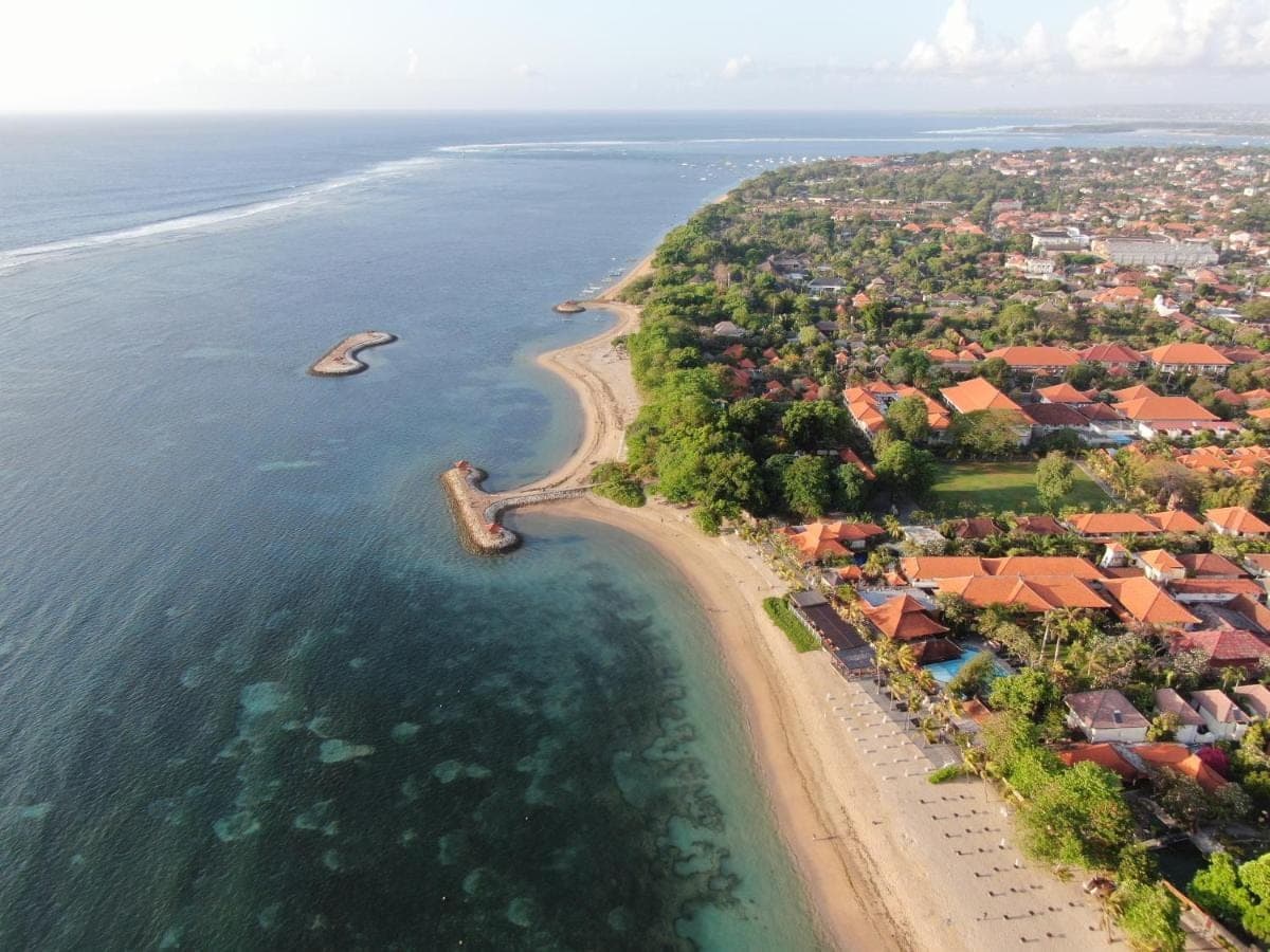 an aerial view of a beach with a resort at Griya Santrian a Beach Resort And Spa in Sanur