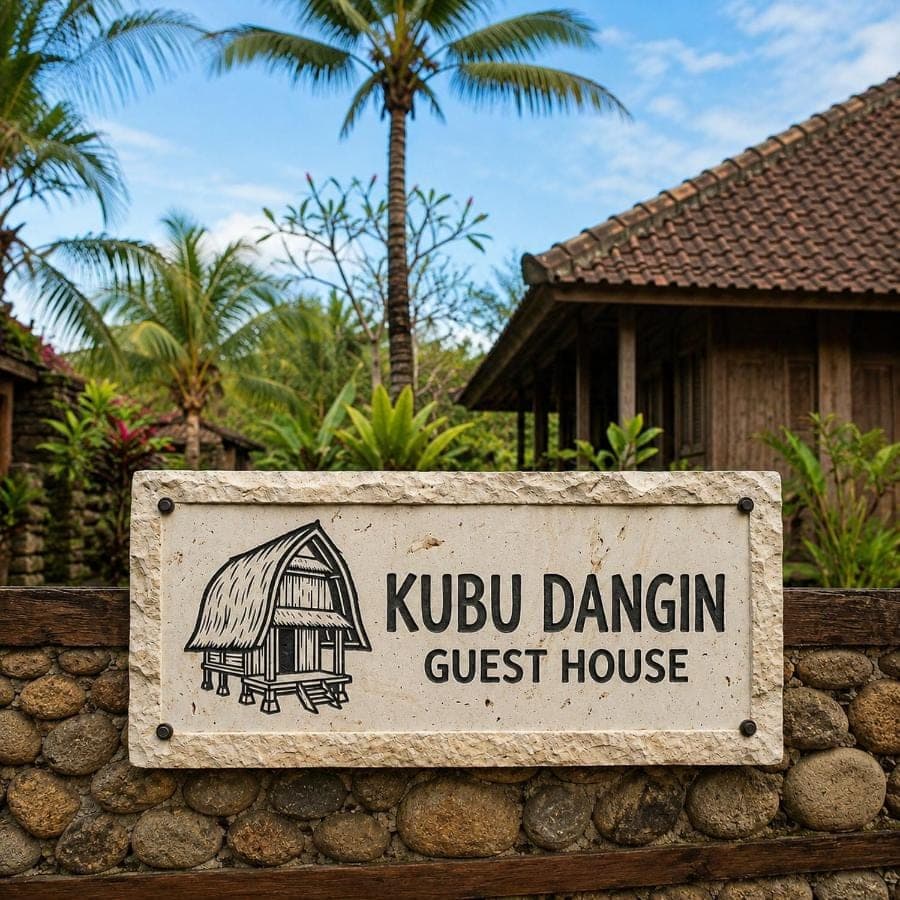 a sign for a guest house at a guest house at Kubu Dangin Ogang Guest House in Sidemen