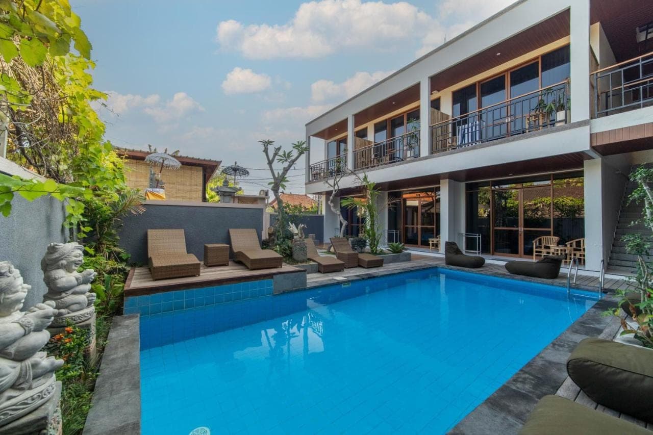 a swimming pool in the backyard of a house at Skyline Sanur by Manara in Sanur