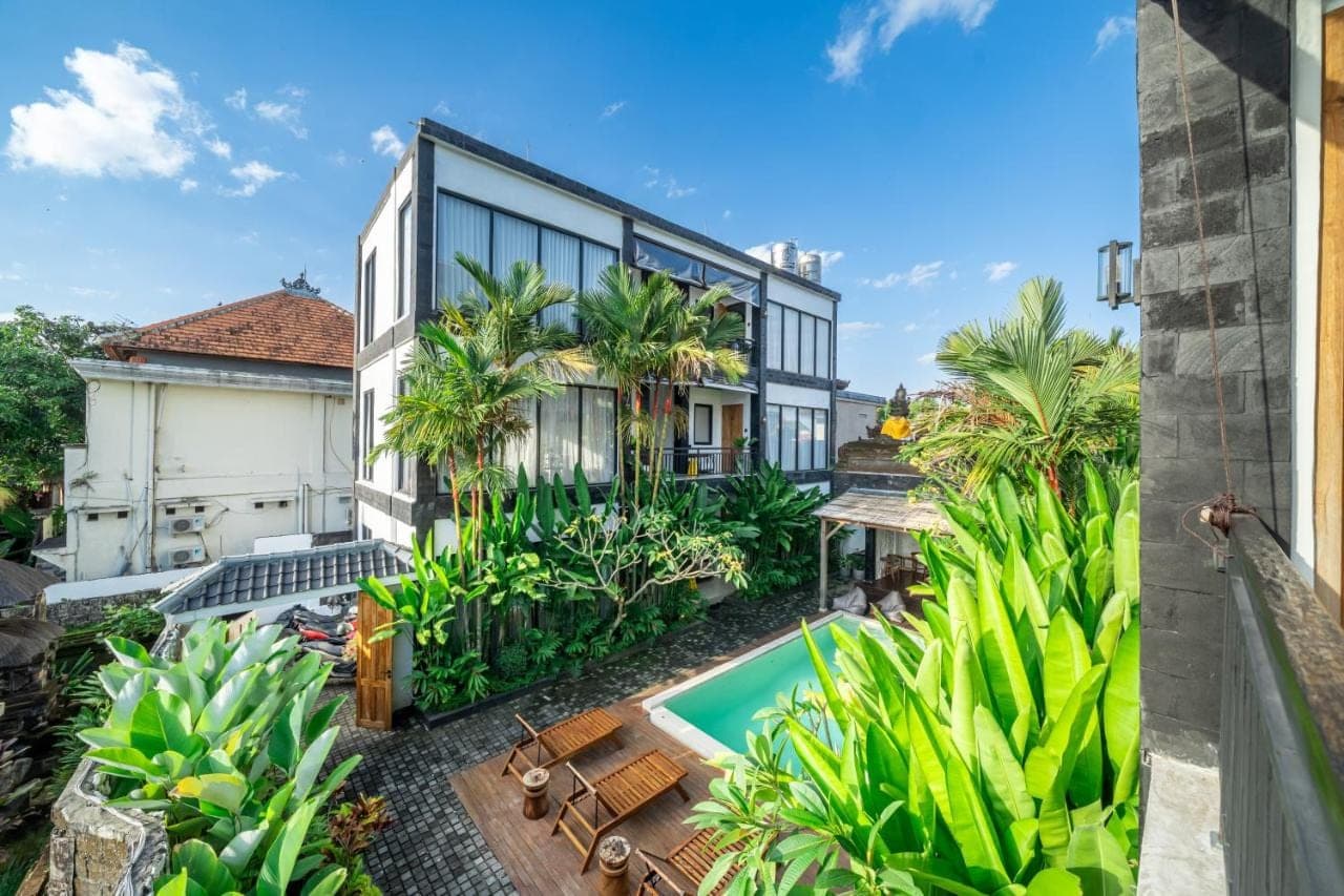 an aerial view of a house with a swimming pool at Sebelas Apartments by EVDEkimi - Modern Stay with Pool near Dining &amp; Shops in Ubud