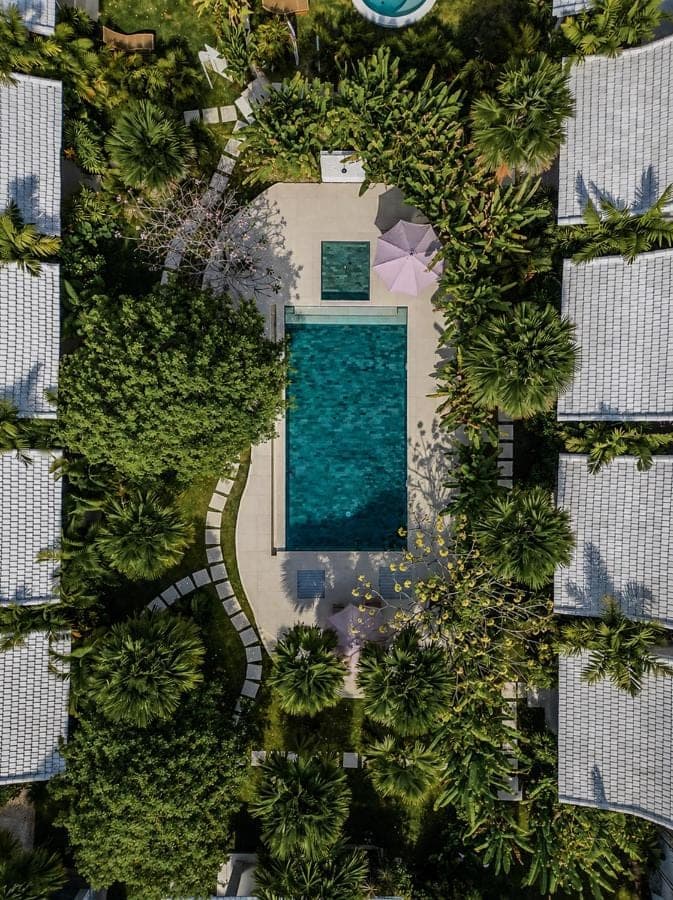 an overhead view of a swimming pool in a resort at Lunatica Bali in Uluwatu