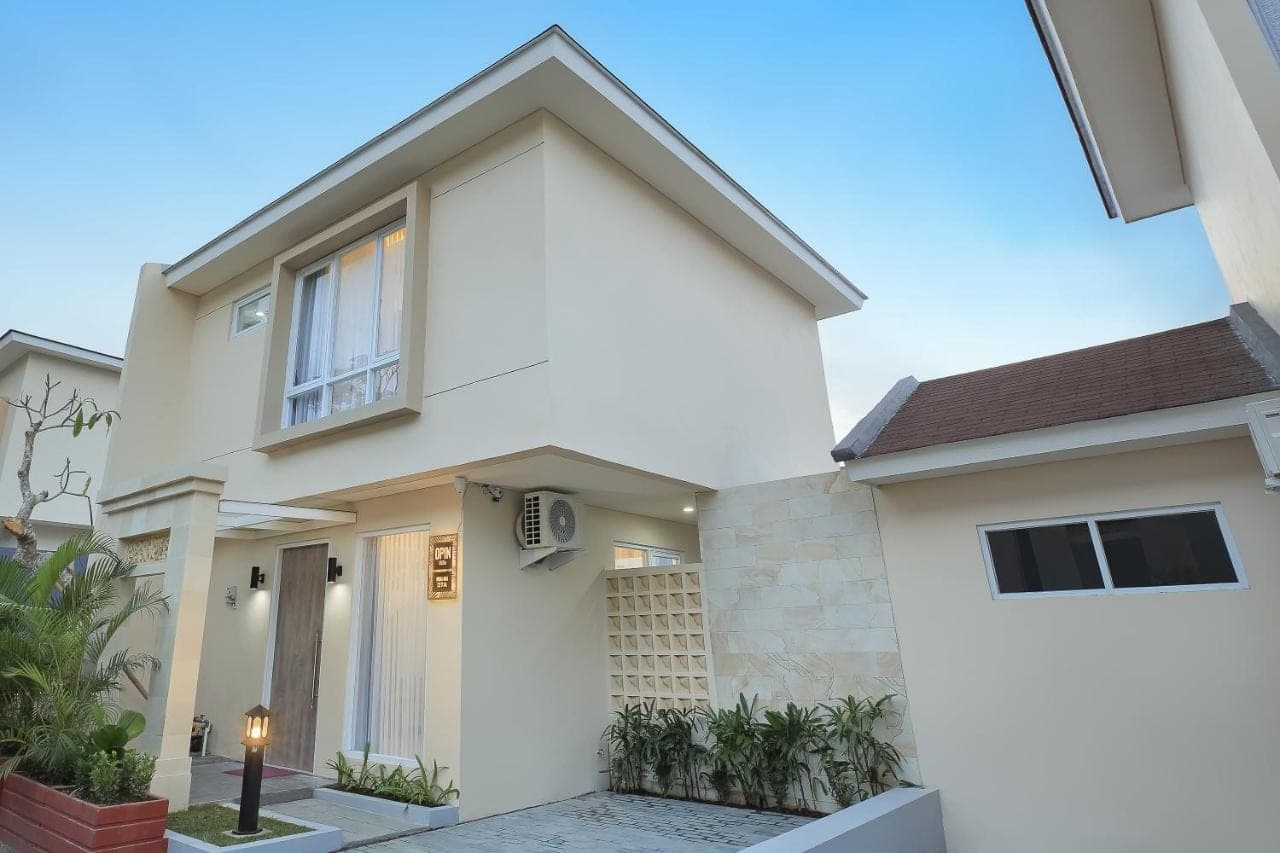 a house with a white facade at Opin Villa in Nusa Dua