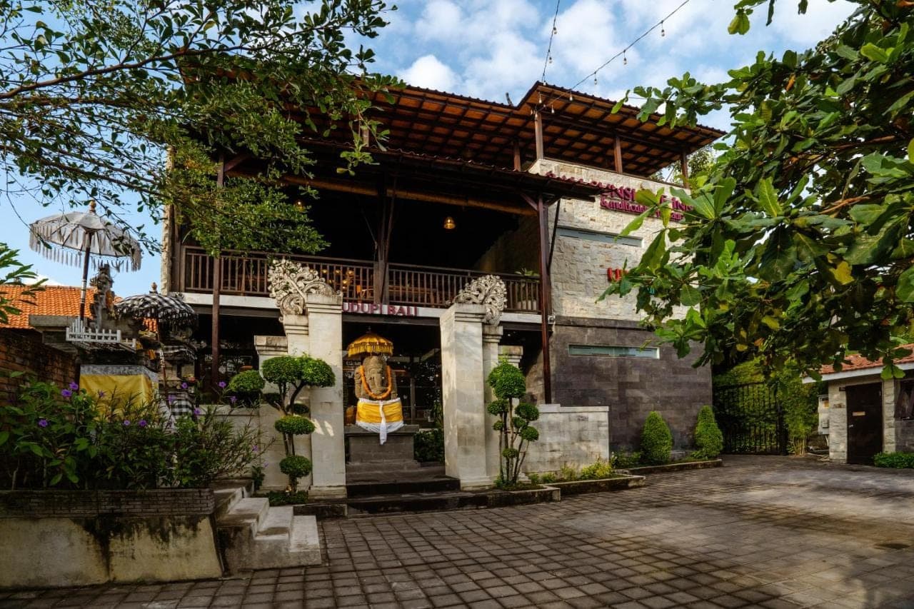 a house with a painting on the side of it at Bali Sunshine Nusa Dua in Nusa Dua