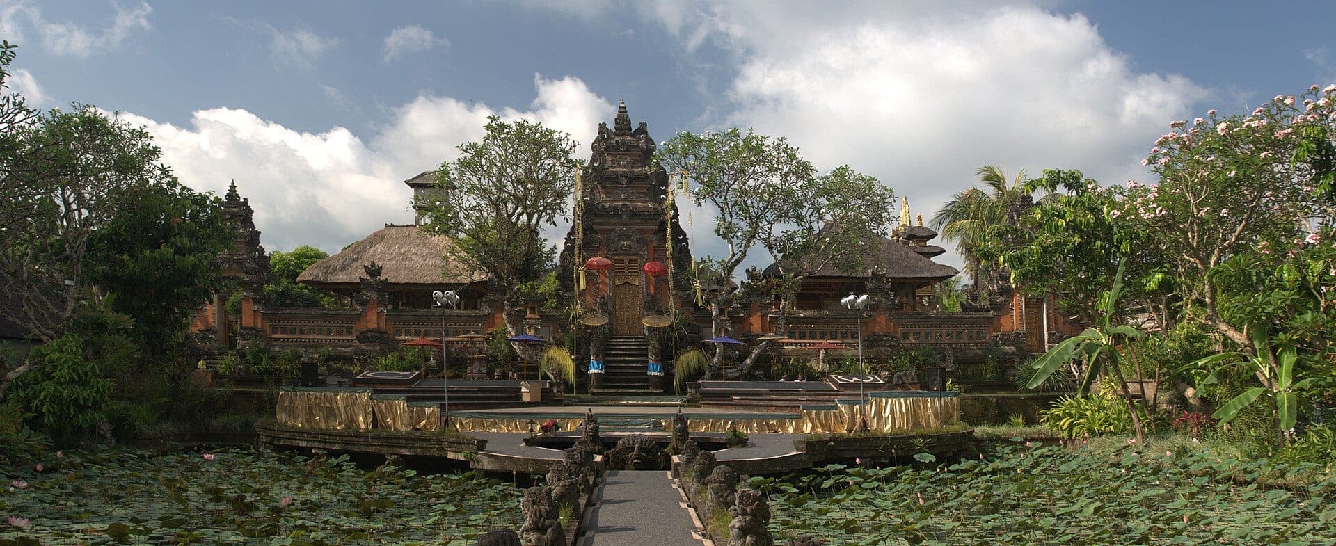 Wide view of Pura Taman Saraswati temple and lotus pond in Ubud