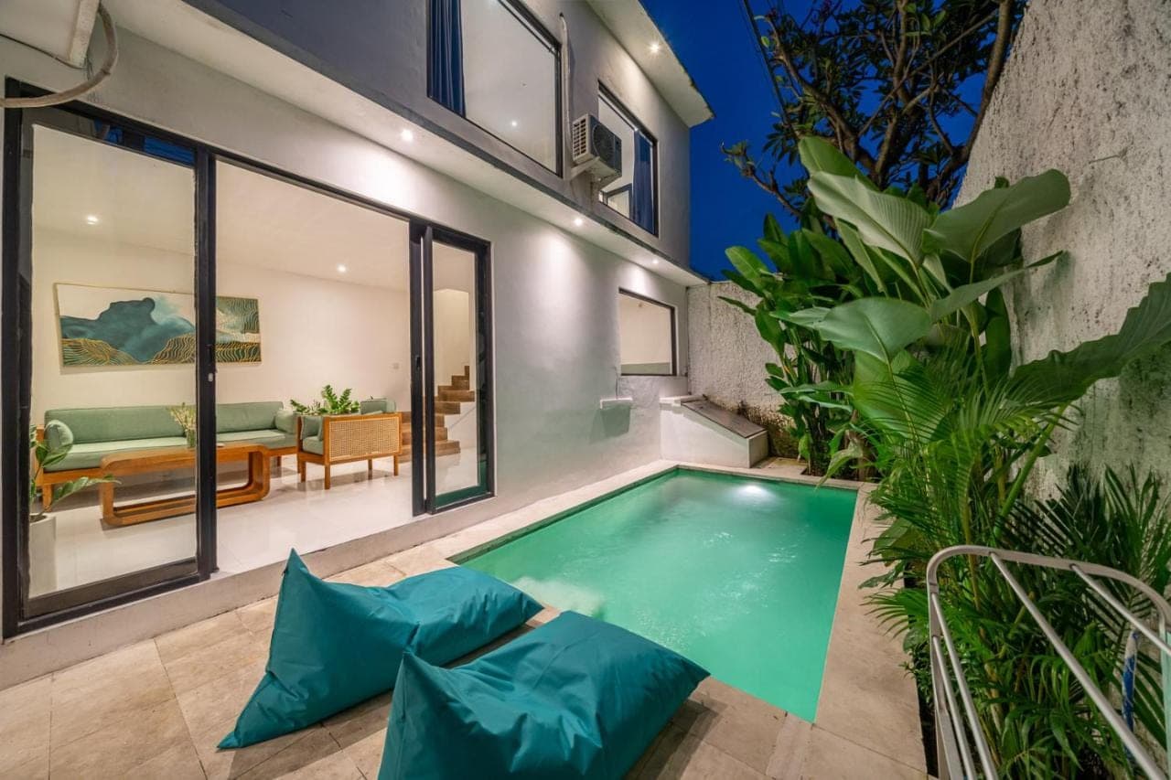 an indoor swimming pool in a house at Nyma 2BR Villa Seminyak in Seminyak