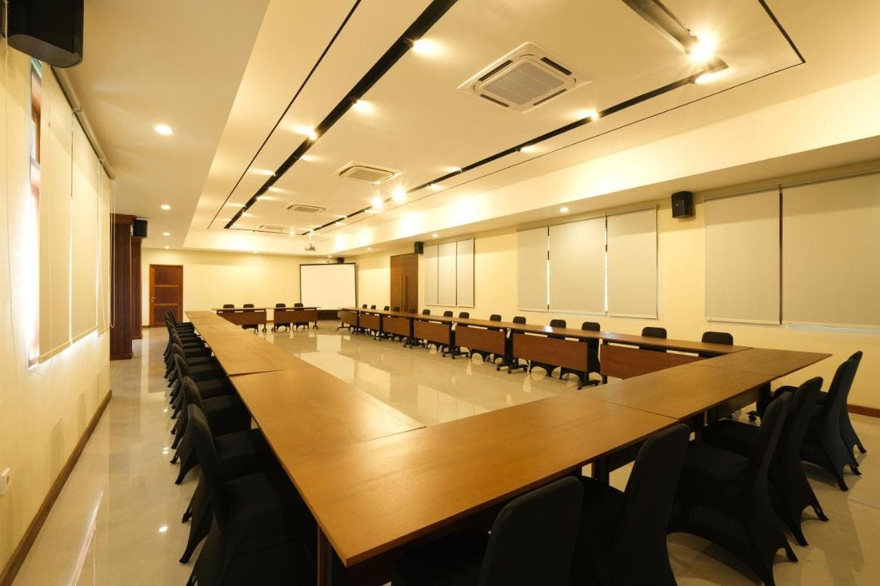 a large conference room with a long table and chairs at Samujha Ubud Resort in Ubud