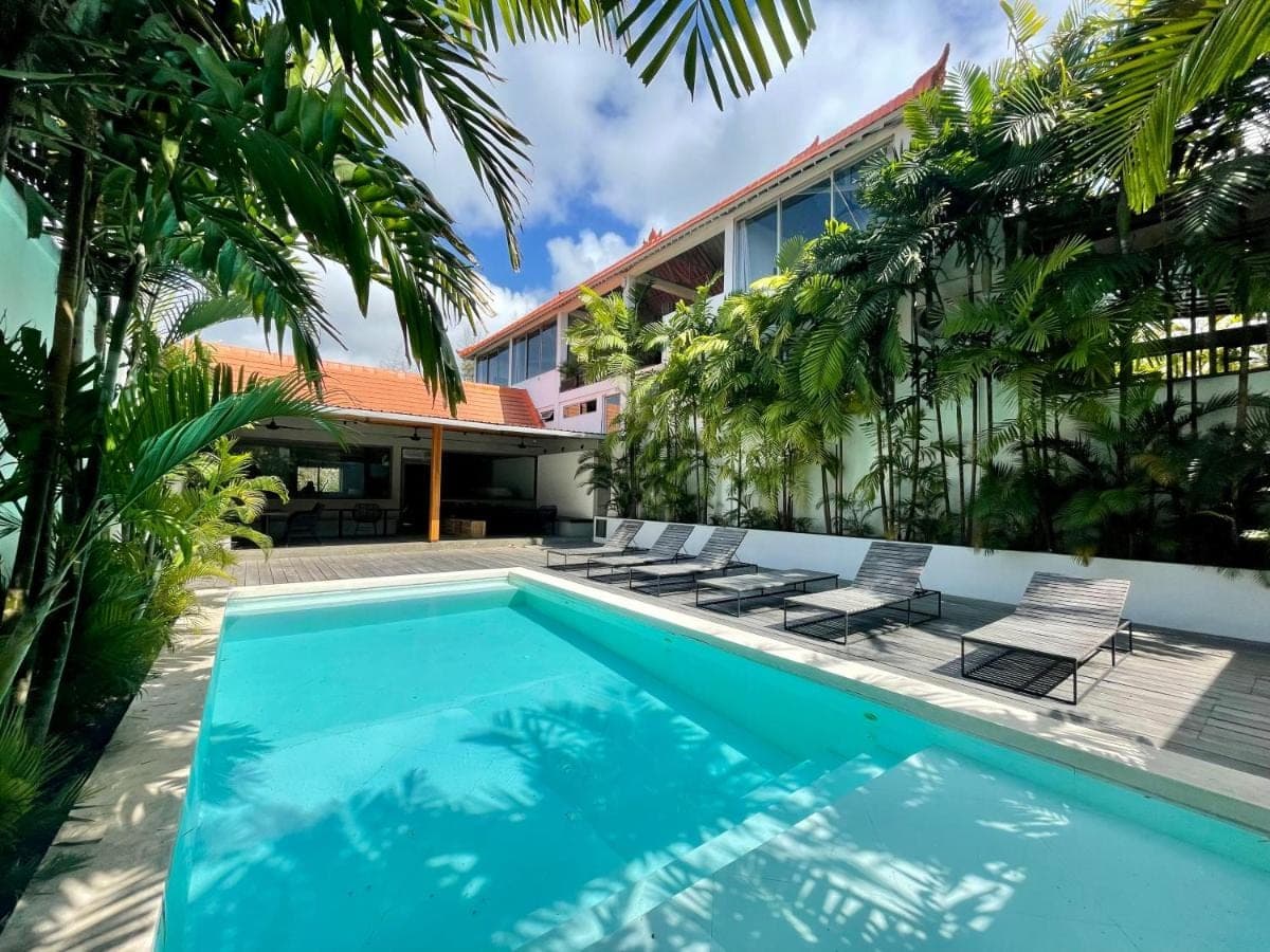 an image of a swimming pool in front of a building at 007 Surfhouse Bali in Uluwatu