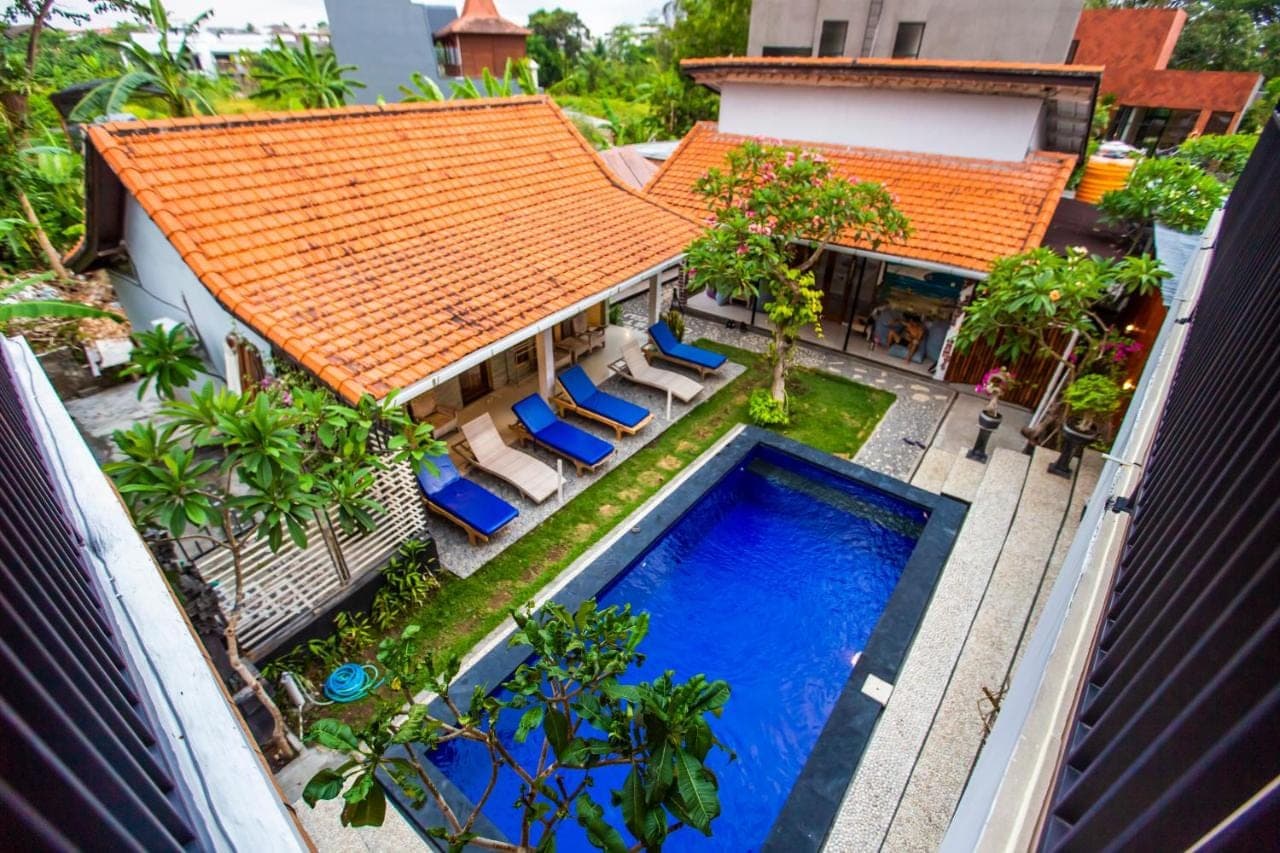 an aerial view of a house with a swimming pool at The Nest Canggu in Canggu