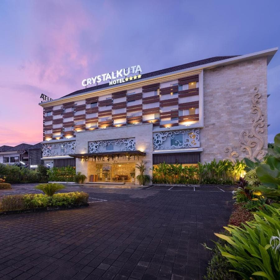 a building with a sign on the front of it at Crystalkuta Hotel - Bali in Kuta