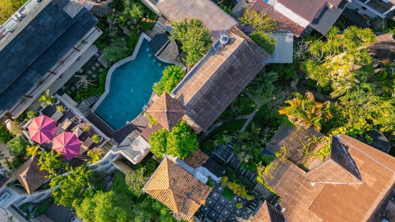 an overhead view of a house with a swimming pool at Home-Bience Hostel in Uluwatu