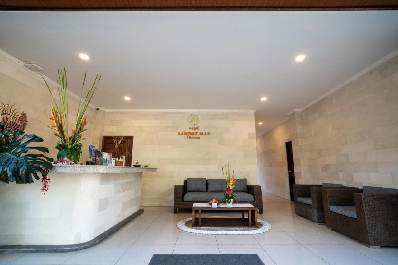 a lobby with a couch and a table at Sandat Mas Uluwatu in Uluwatu