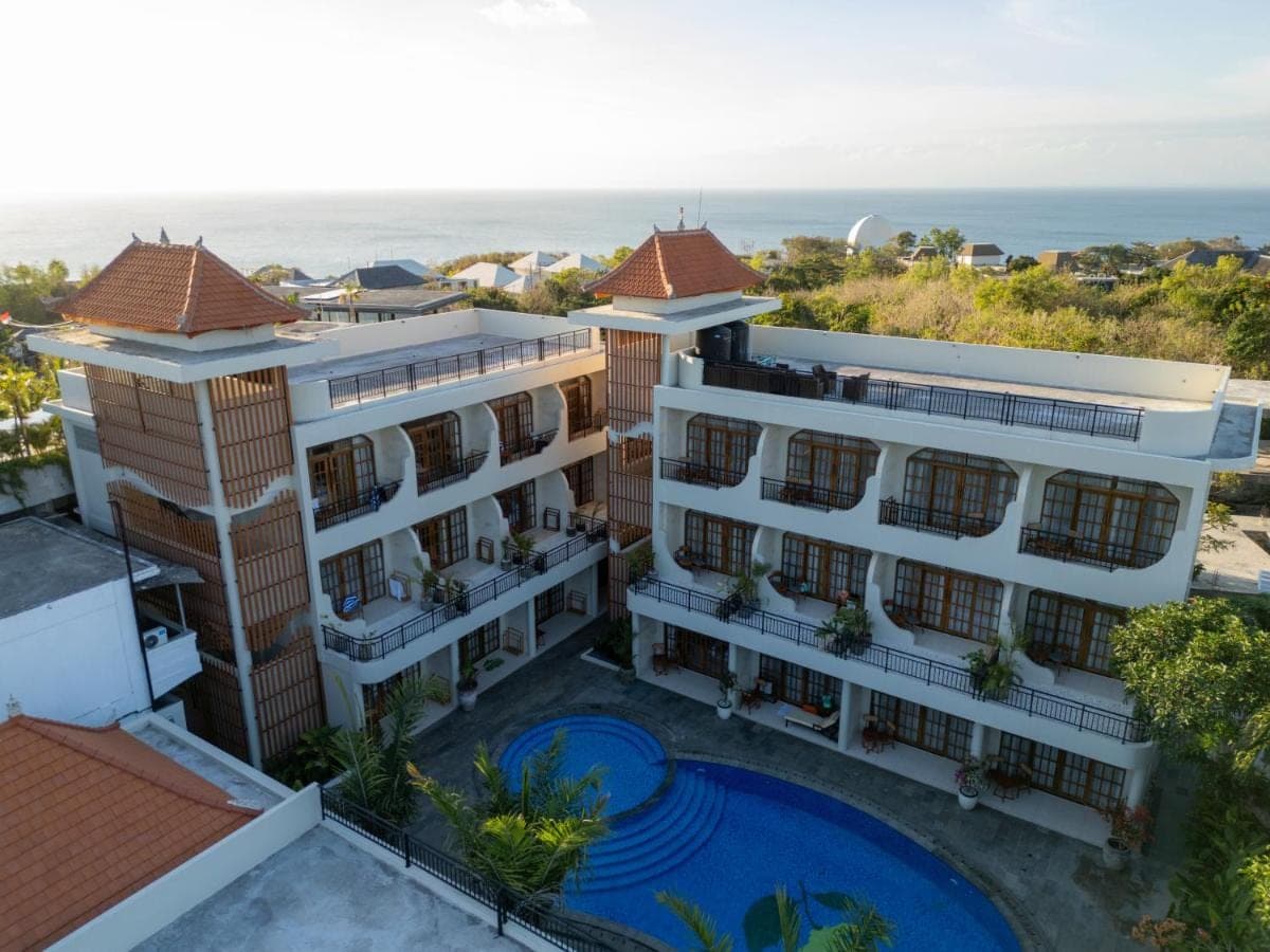 an aerial view of a hotel with the ocean in the background at Sandat Mas Uluwatu in Uluwatu
