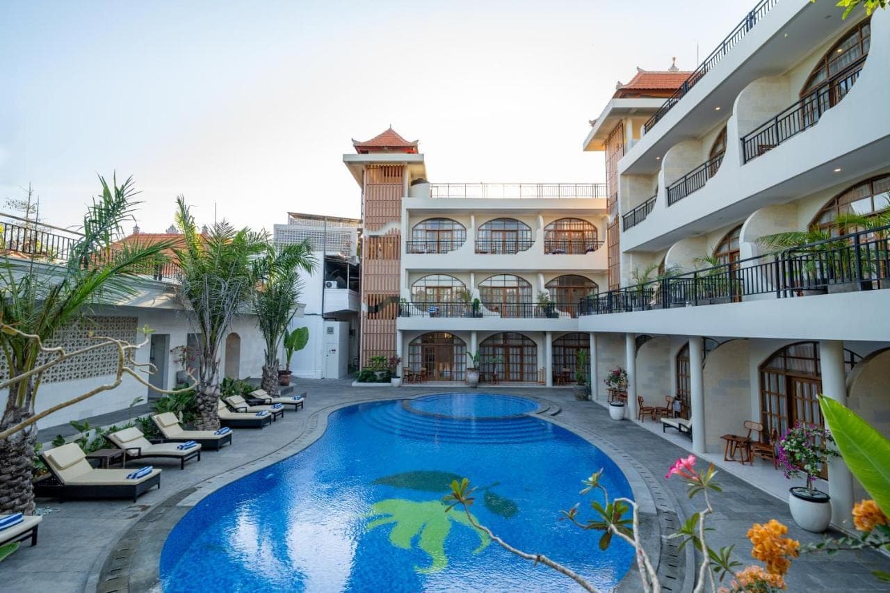a pool in the courtyard of a hotel at Sandat Mas Uluwatu in Uluwatu