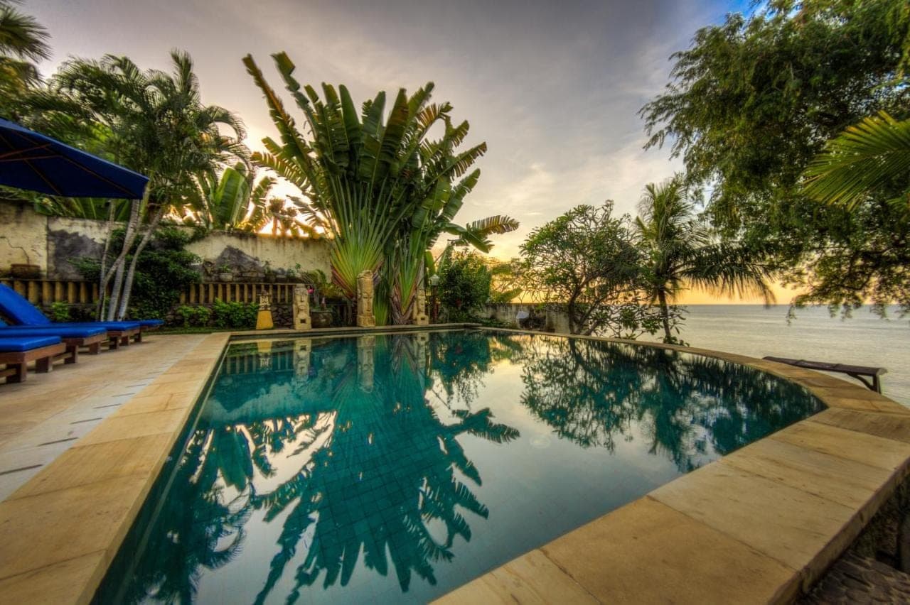 a swimming pool with a view of the water at Onlyou Villas in Amed