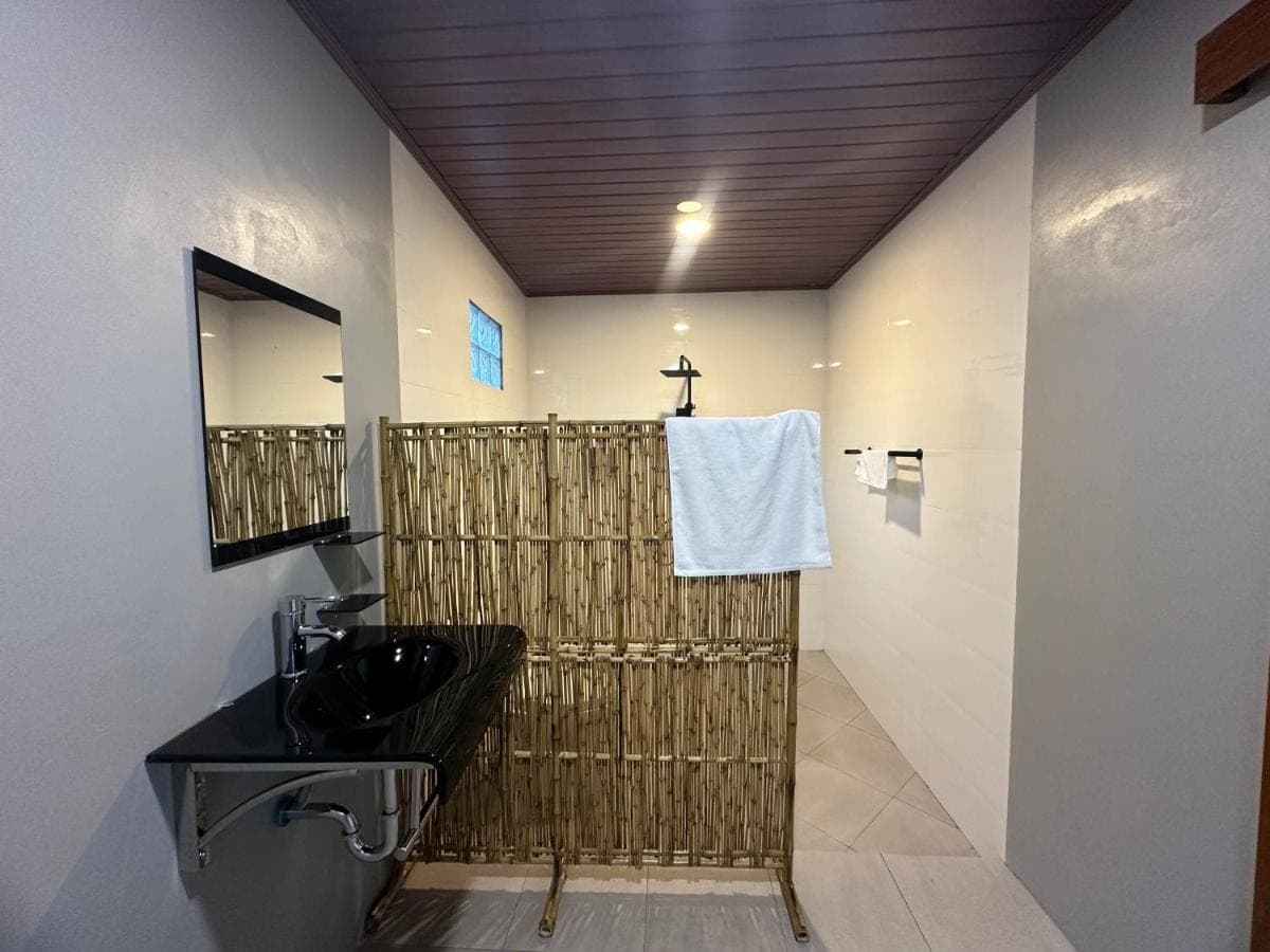 a bathroom with a sink and a towel at Made Putu homestay in Sidemen