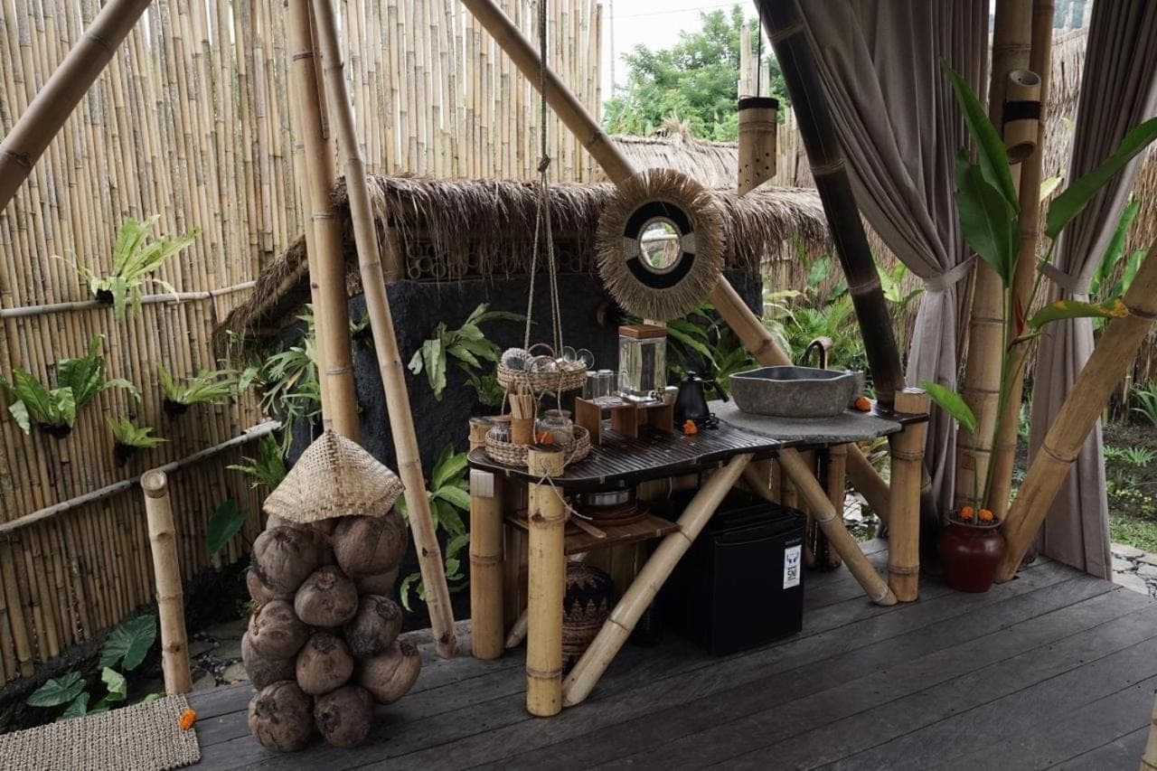 a patio with a table and a bunch of vegetables at Nivriti Bali in Sidemen
