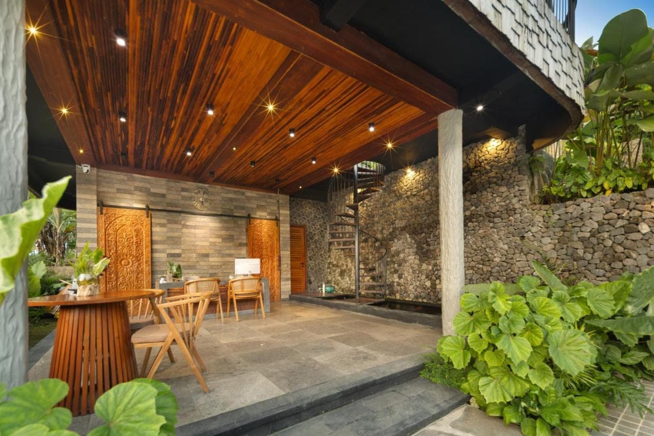 an outdoor patio with a table and chairs at Kankhara Villas Sidemen in Sidemen