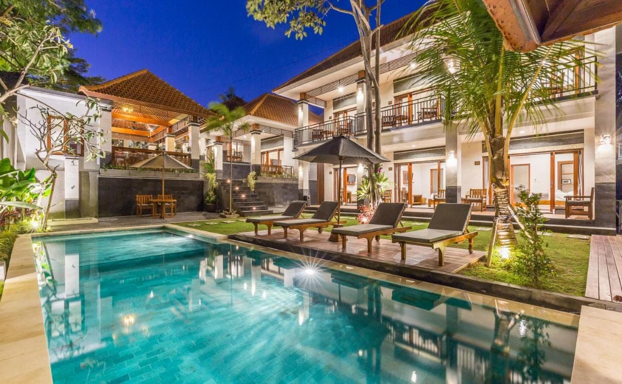 an exterior view of a villa with a swimming pool at Soki Villa in Canggu