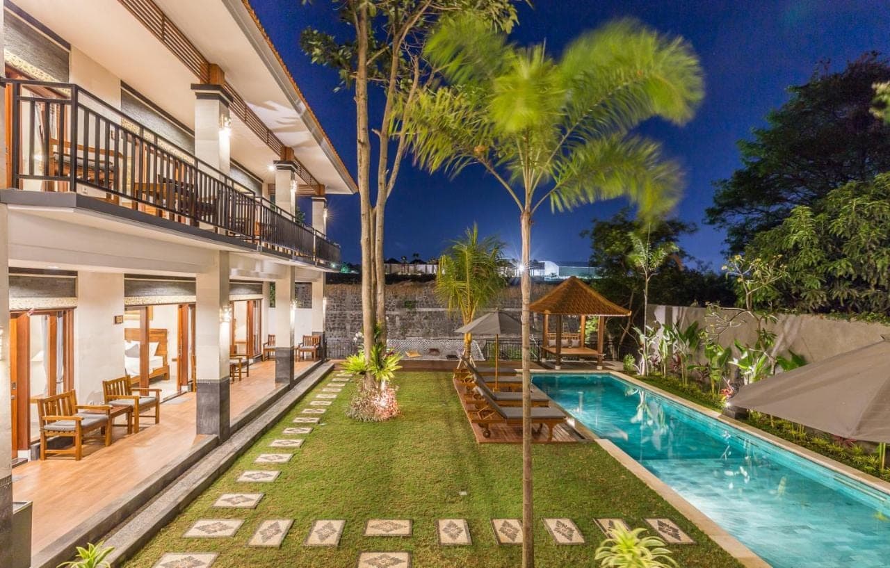 an exterior view of a villa with a swimming pool at Soki Villa in Canggu