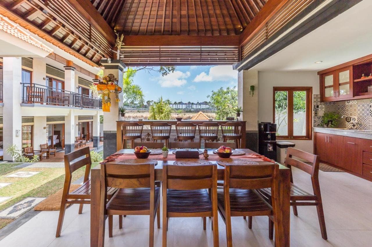 a kitchen and dining room with a table and chairs at Soki Villa in Canggu