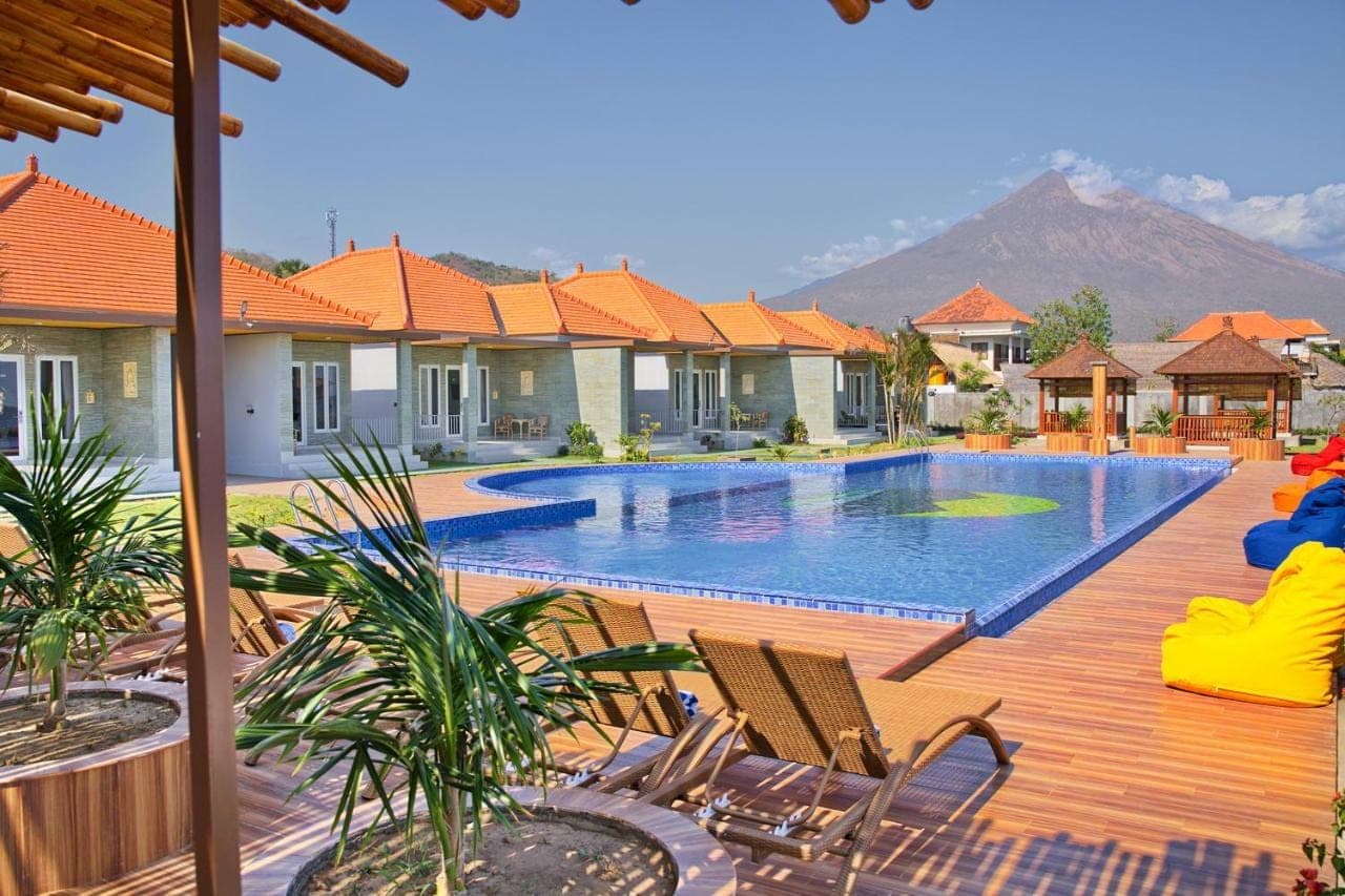 a swimming pool in the middle of a house at Seamount Hotel Amed in Amed