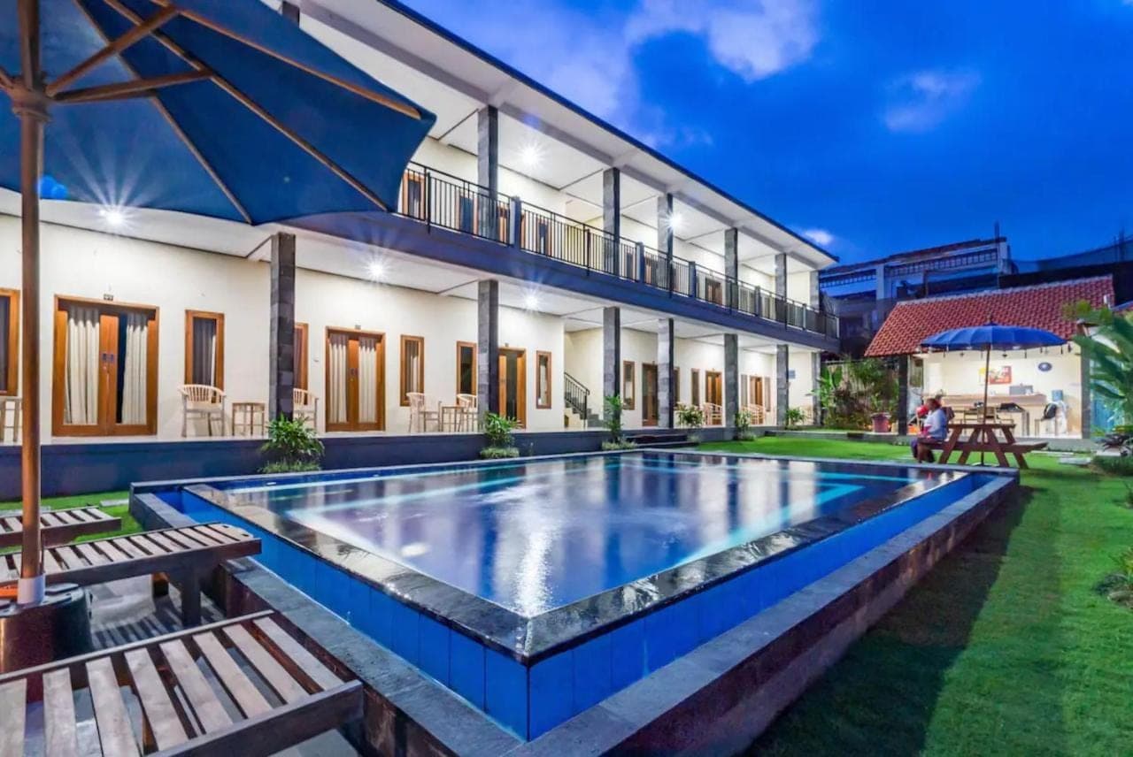 a swimming pool in the backyard of a house at Pondok Lulik Homestay Canggu in Canggu