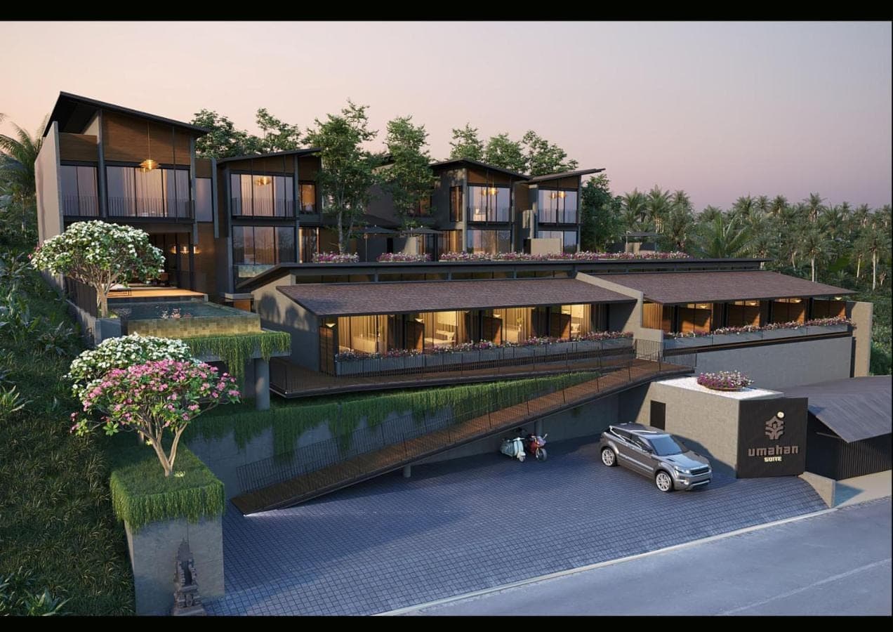 a large building with a car parked in front of it at Umahan Ubud in Ubud