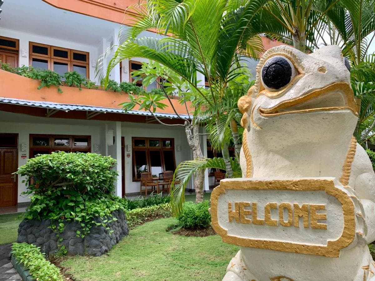 a sign in front of a house with a turtle at Febri's Hotel &amp; Spa in Kuta