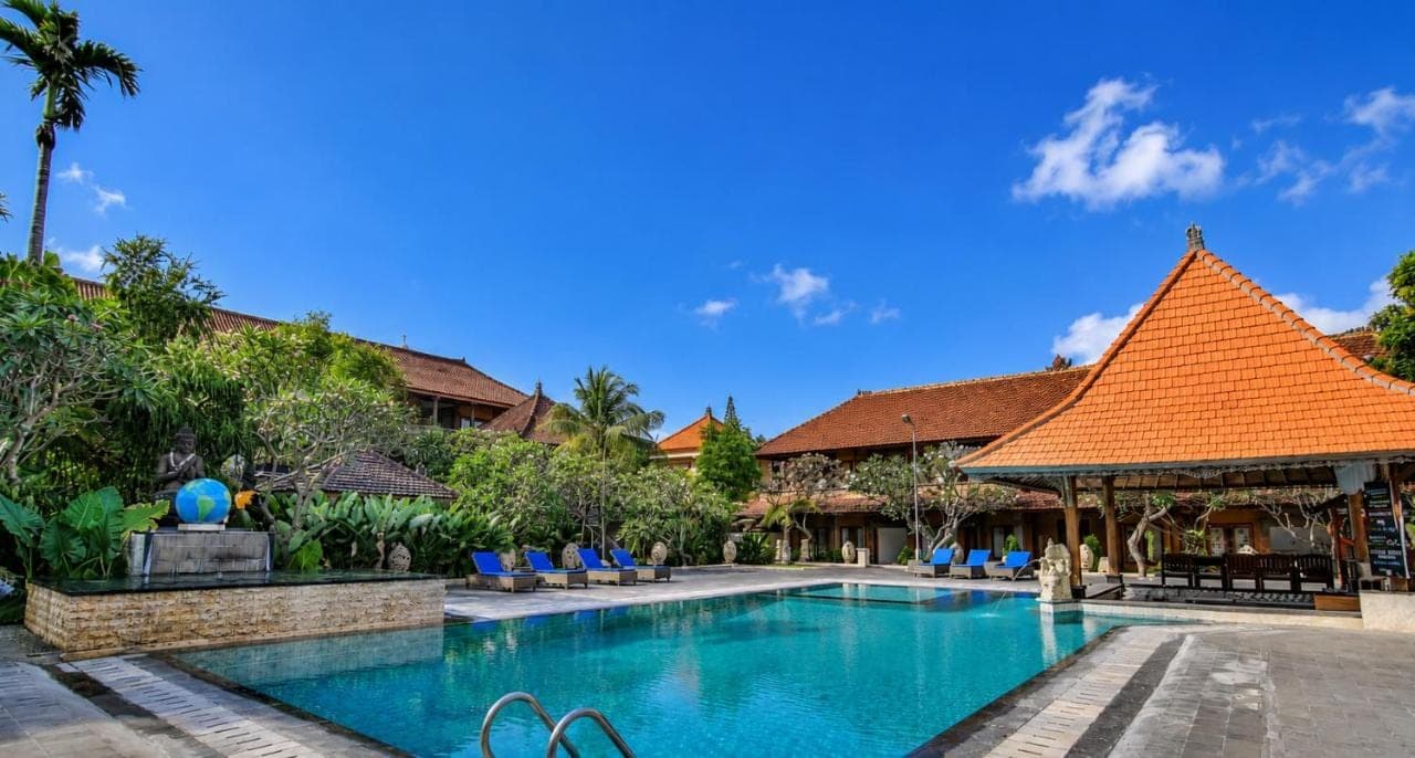 an image of a swimming pool at a resort at Satriya Cottages in Kuta
