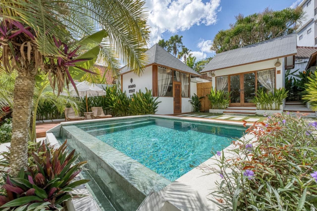 an image of a swimming pool in the backyard of a house at Noho Stay Bali in Uluwatu