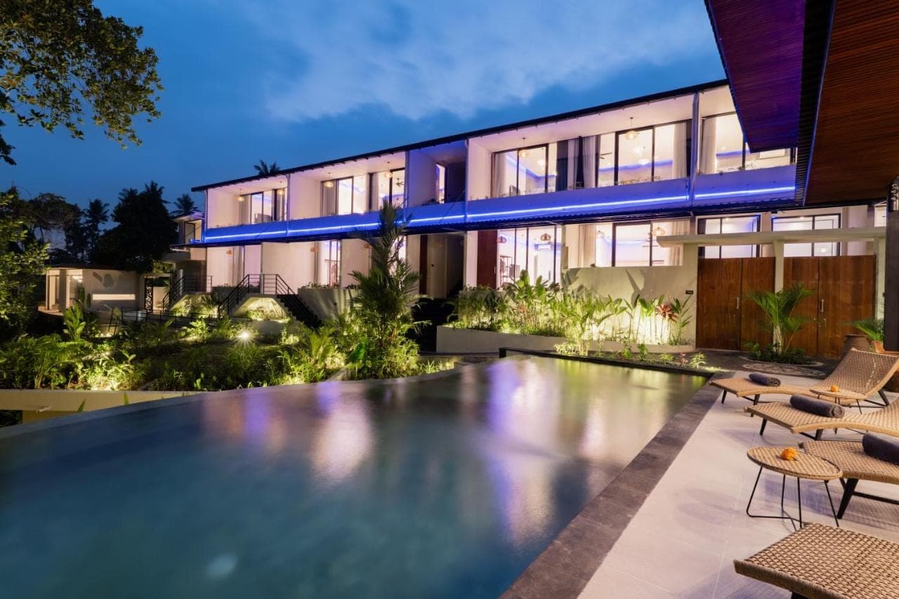 an empty swimming pool in front of a house at Lula Boutique by The Studios Ubud Adult Only in Ubud