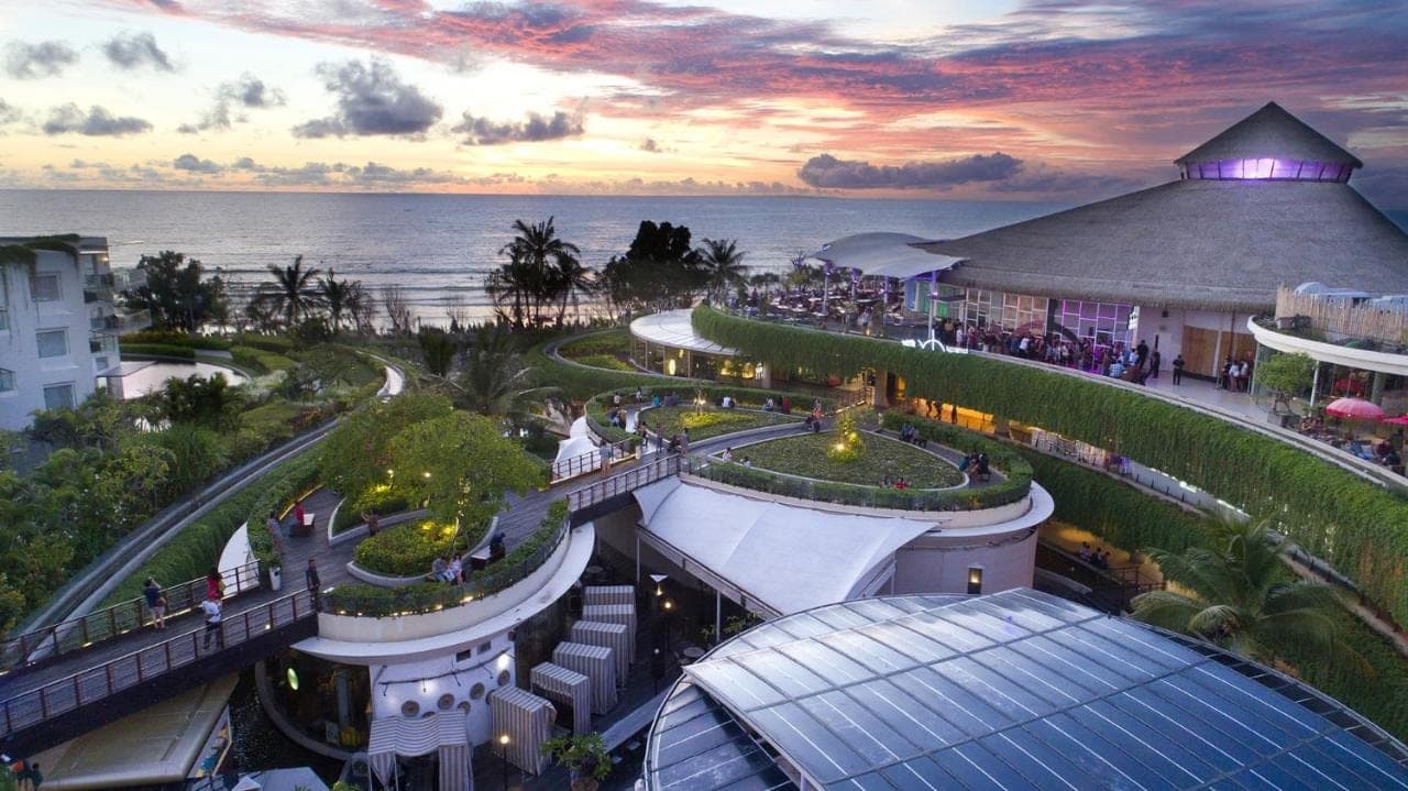 an aerial view of a resort with the ocean in the background at YELLO Hotel Kuta Beachwalk Bali in Kuta