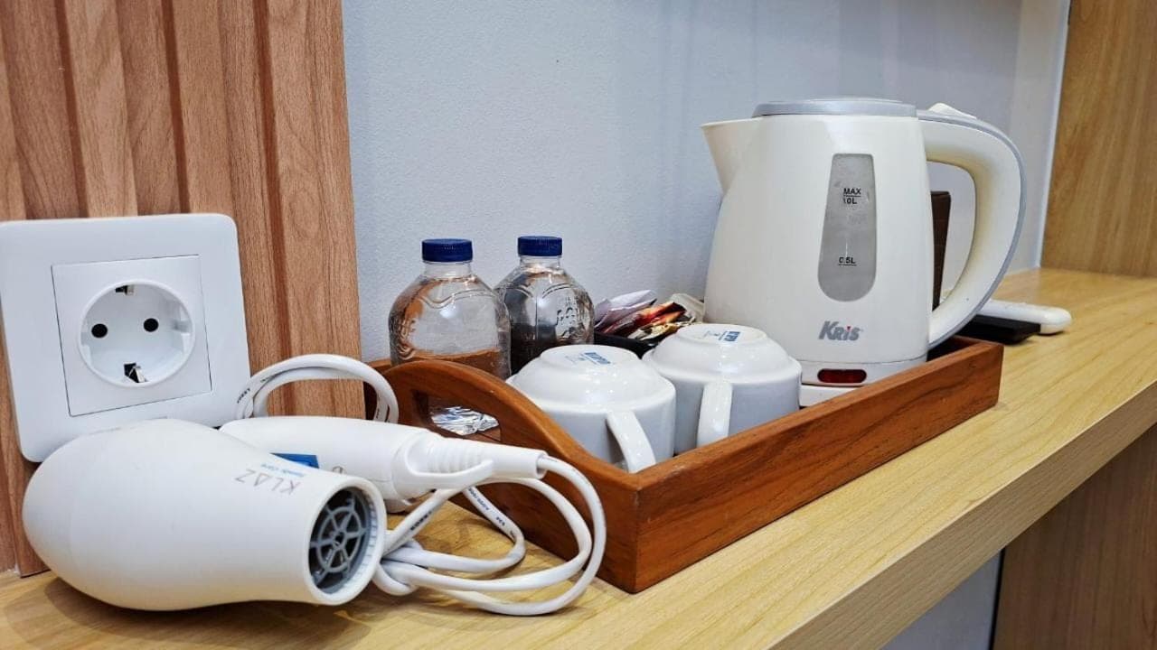 a counter top with a coffee maker and a blender at Mahesa Seminyak in Seminyak