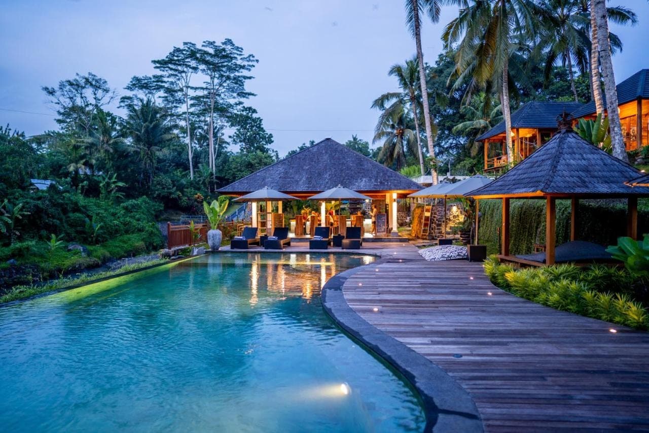 a pool at a resort with at Taman Swarga Villa Resort &amp; Spa Sidemen in Sidemen