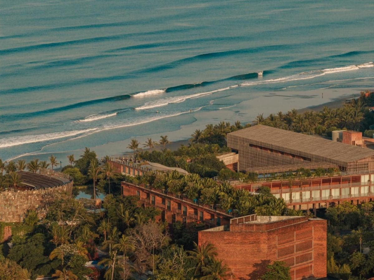 an aerial view of the ocean and buildings at Desa Potato Head Bali in Seminyak