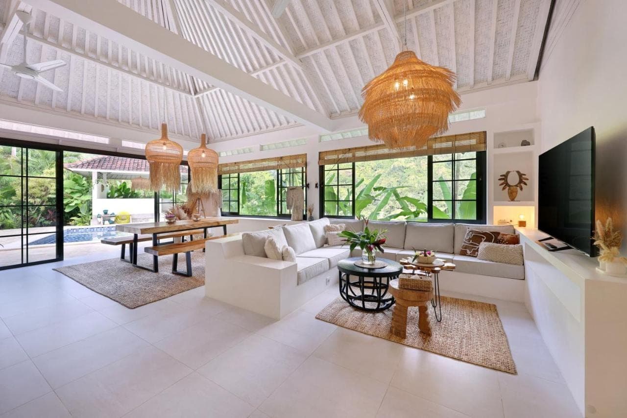 a large living room with a large ceiling at Tropical Habitat Bali in Amed