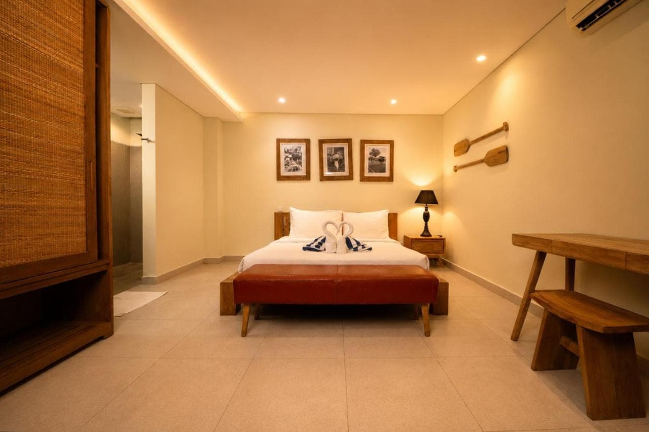 a bedroom with a bed in a room at Mono Villa - Nusa Dua in Nusa Dua